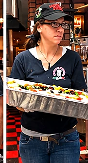 Monty’s team member serving freshly prepared food